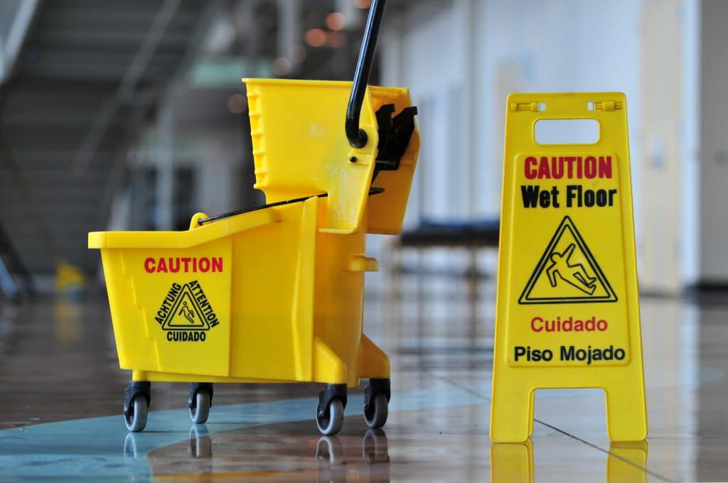 Wet floor sign with mop bucket