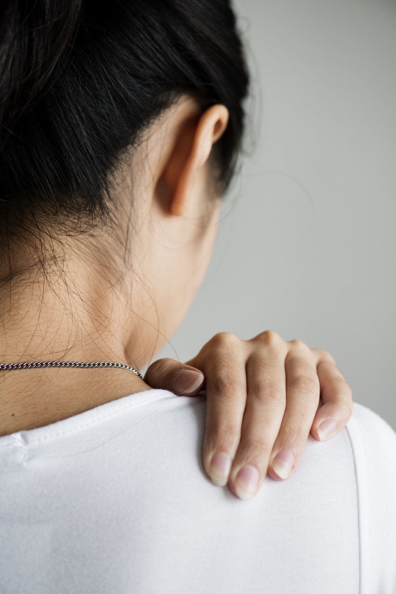 Asian woman suffering back pain