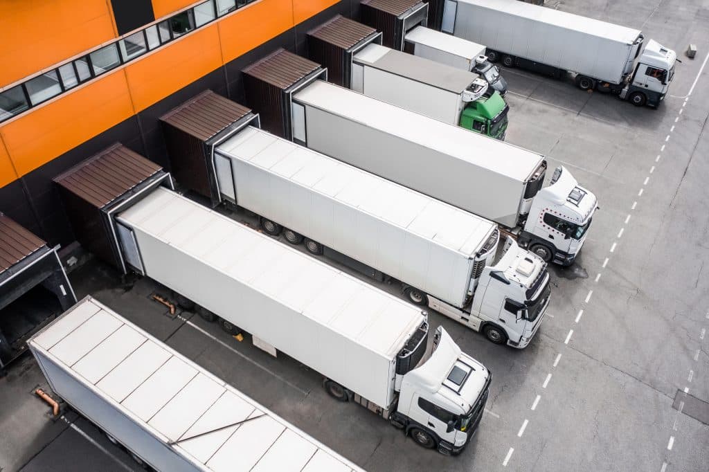 Aerial view of commercial trucks loading in the distribution hub