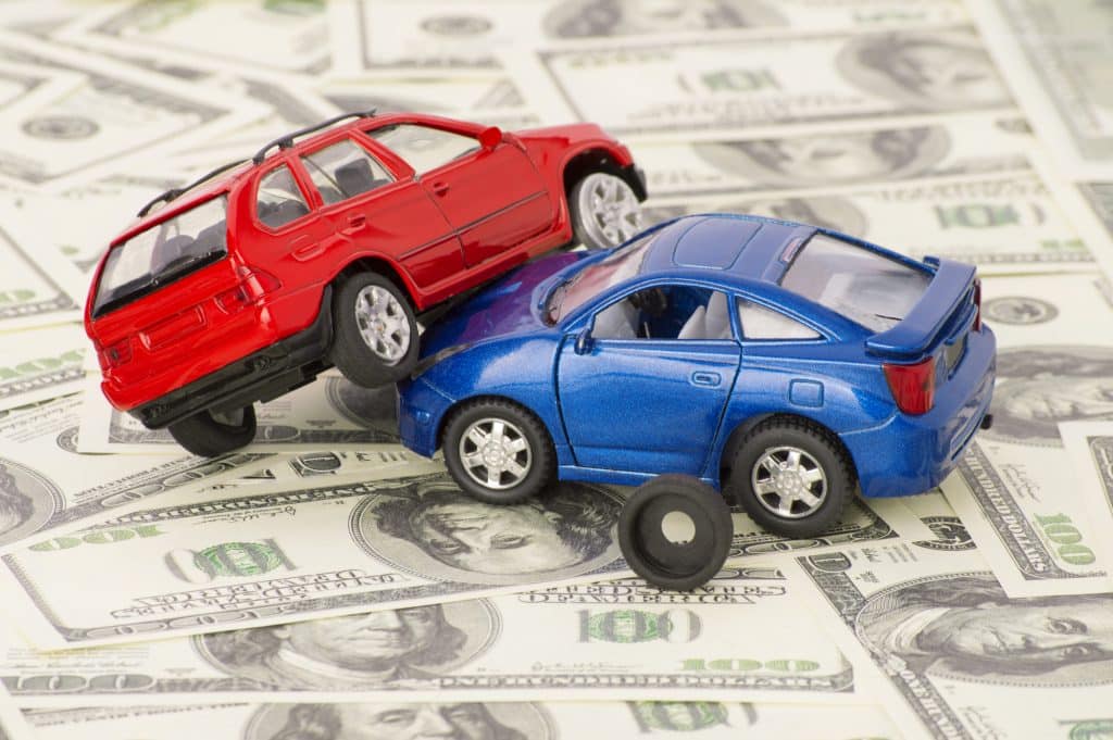 toy cars involved in accident on top of cash