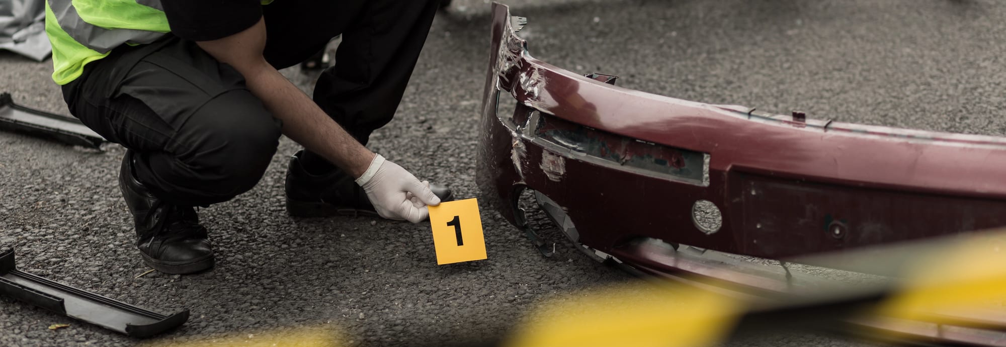 closeup of cop investigating accident