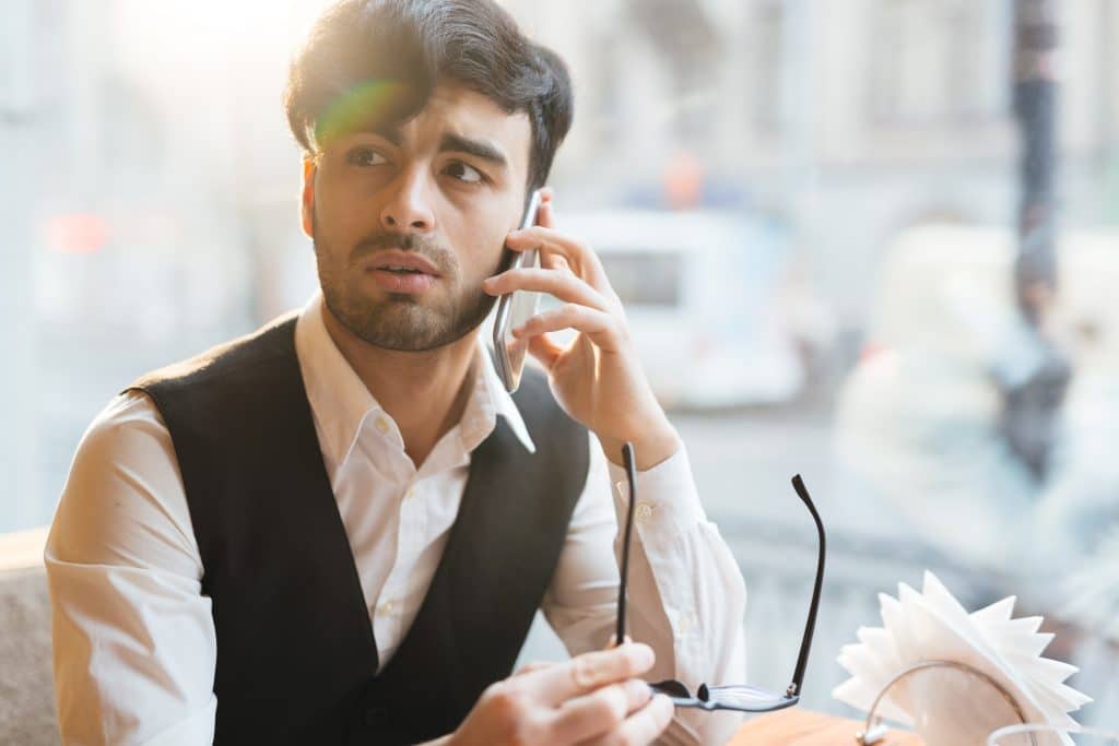 Concerned man on serious phone call
