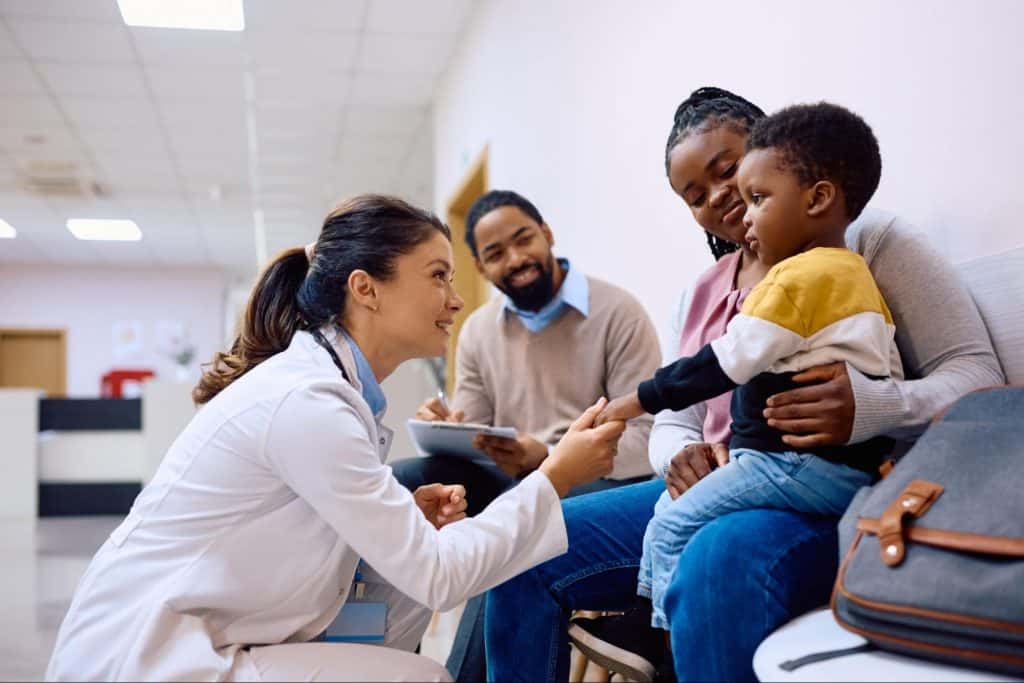 Female Doctor examining a family after a car accident near Disney.