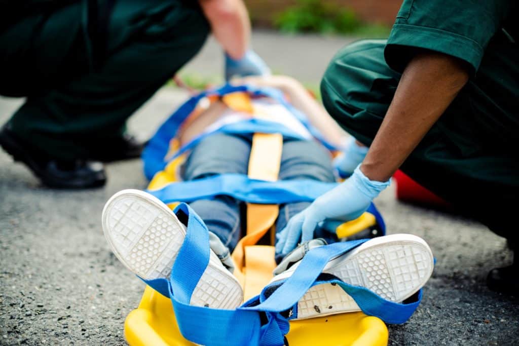 paramedics treating accident victim