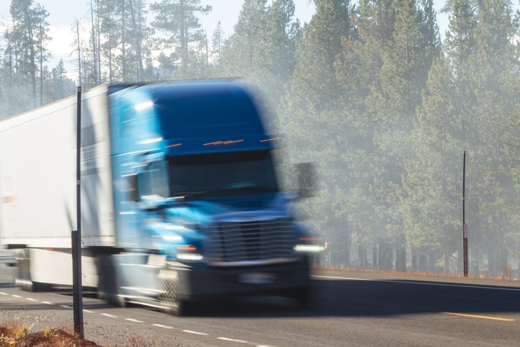 blurry semi truck on the highway